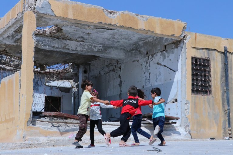 ch1362107_children_playing_outside_their_school-_idlib_syria 23 (1).jpg
